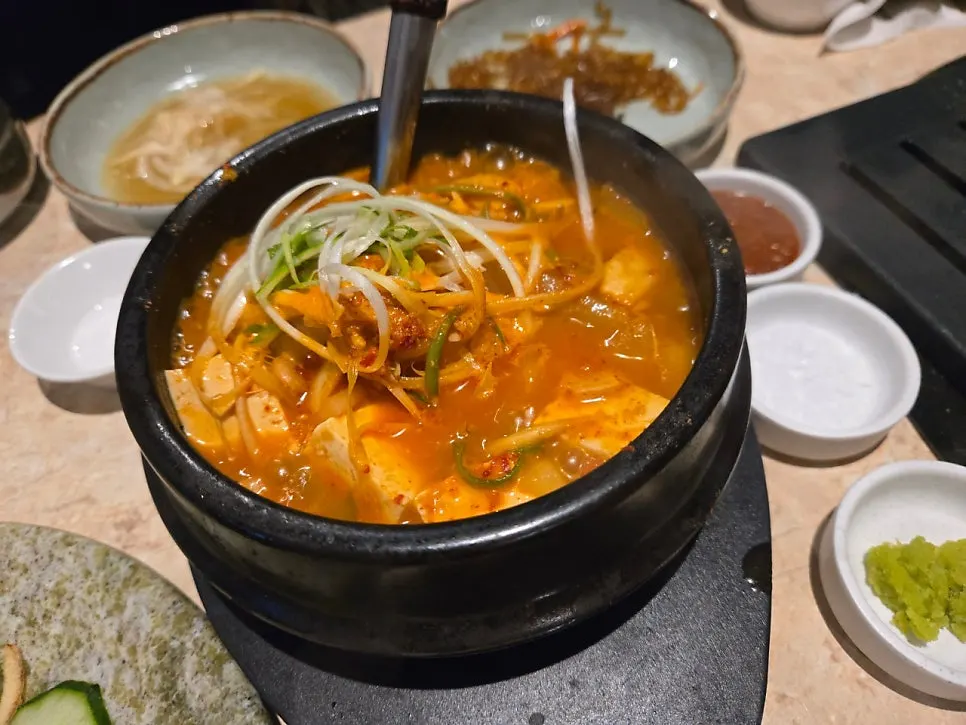Doenjang stew served alongside the meat