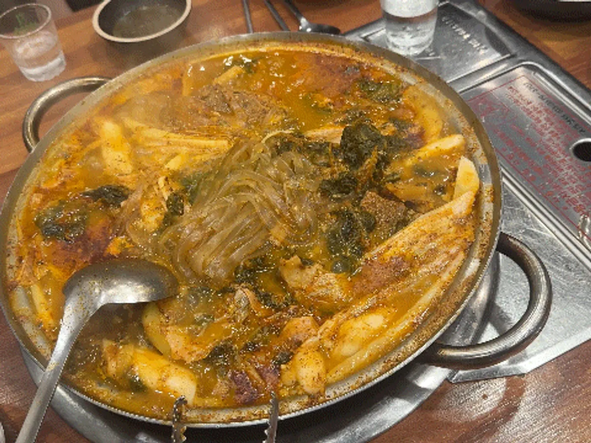 Boseung's gamjatang bubbling on the burner