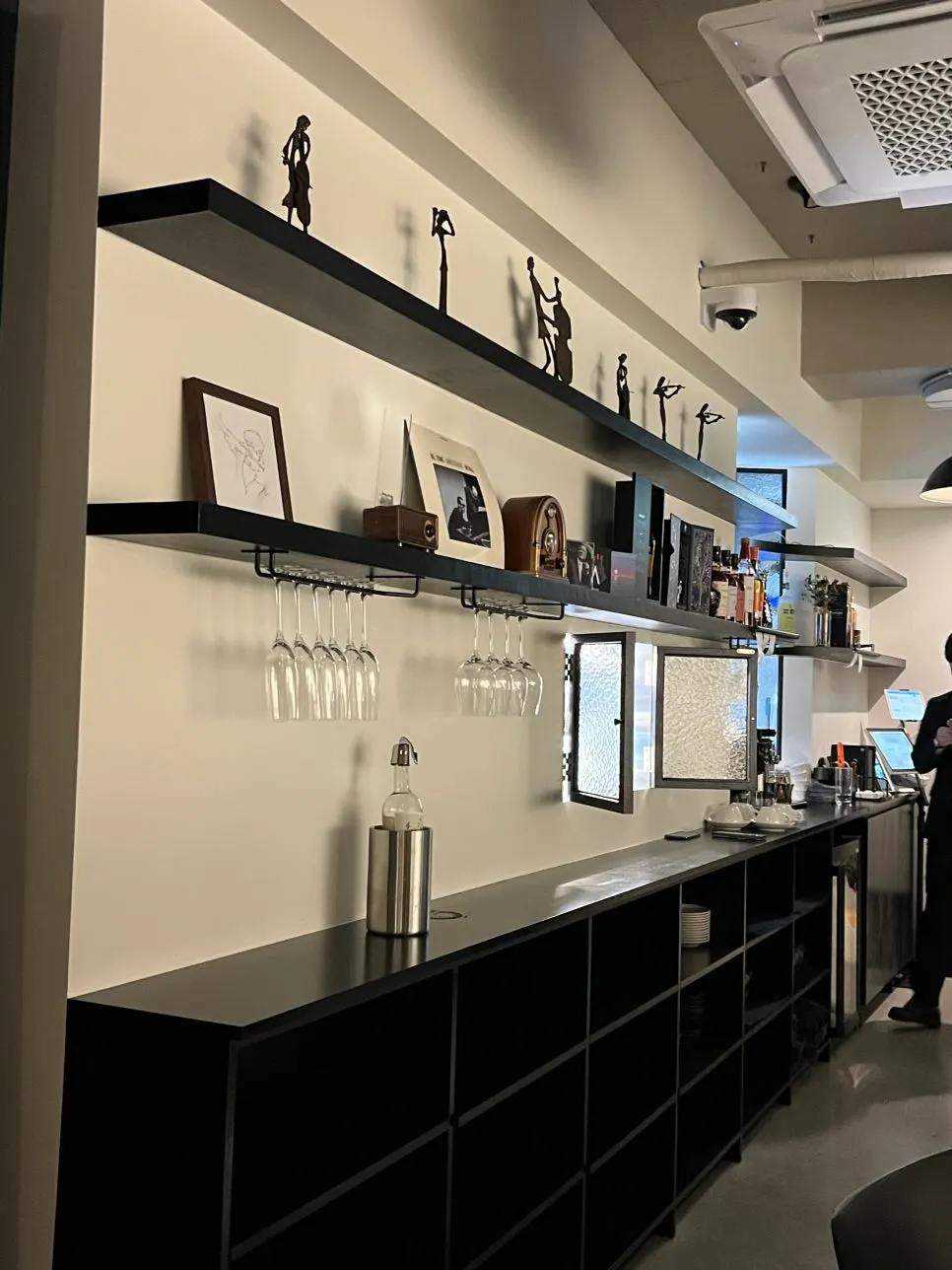 Allegro's bar counter with hanging wine glasses