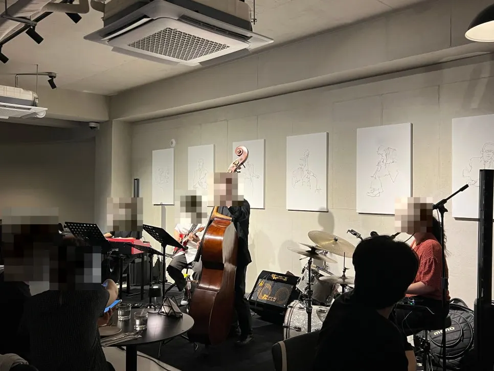 Four-piece jazz band performing just steps from the tables