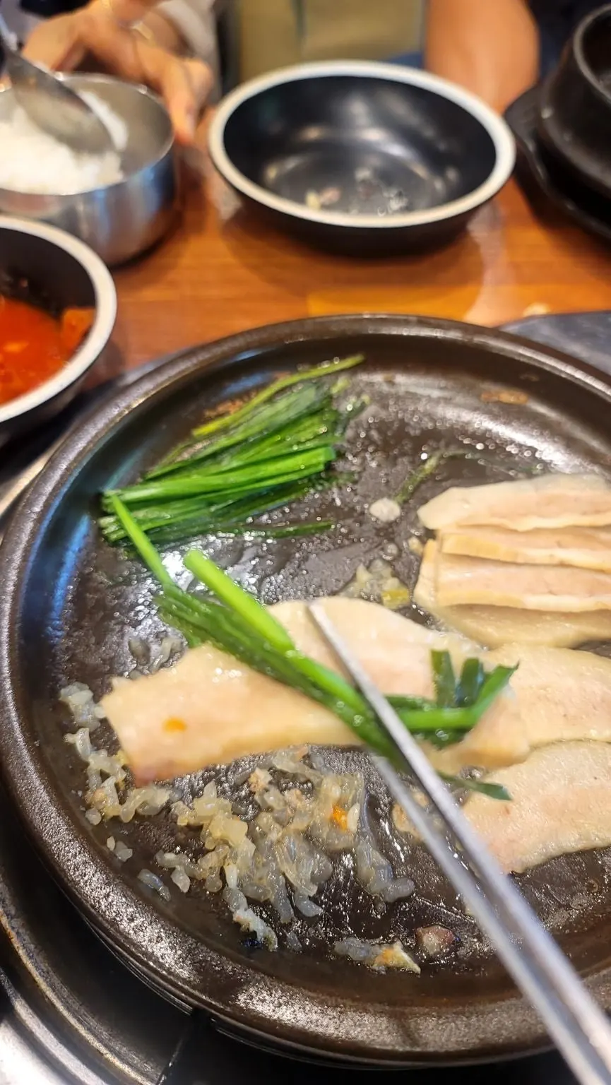 Thinly sliced pork jowl boiled meat soaking in broth