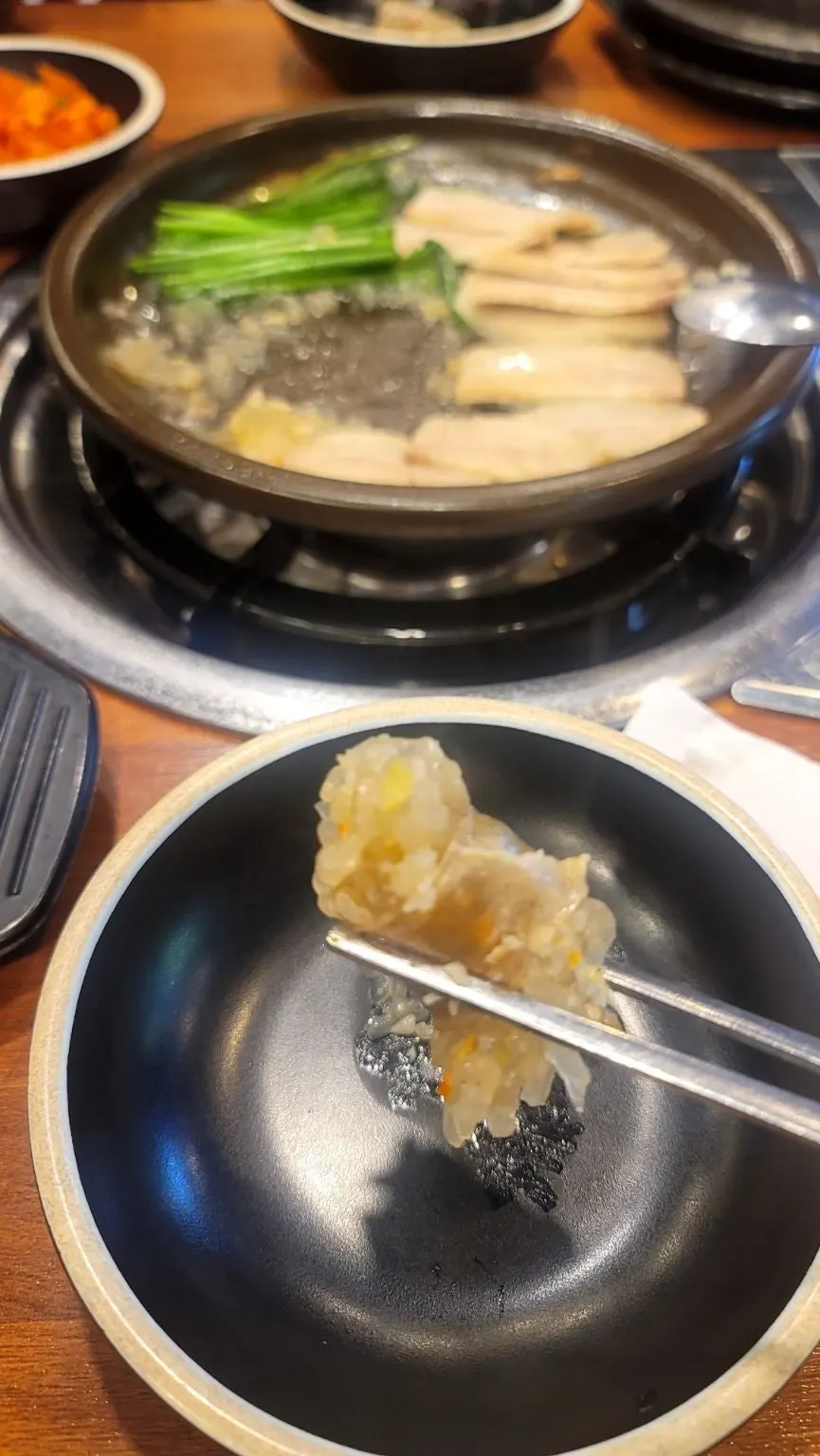 A piece of boiled pork paired with chives