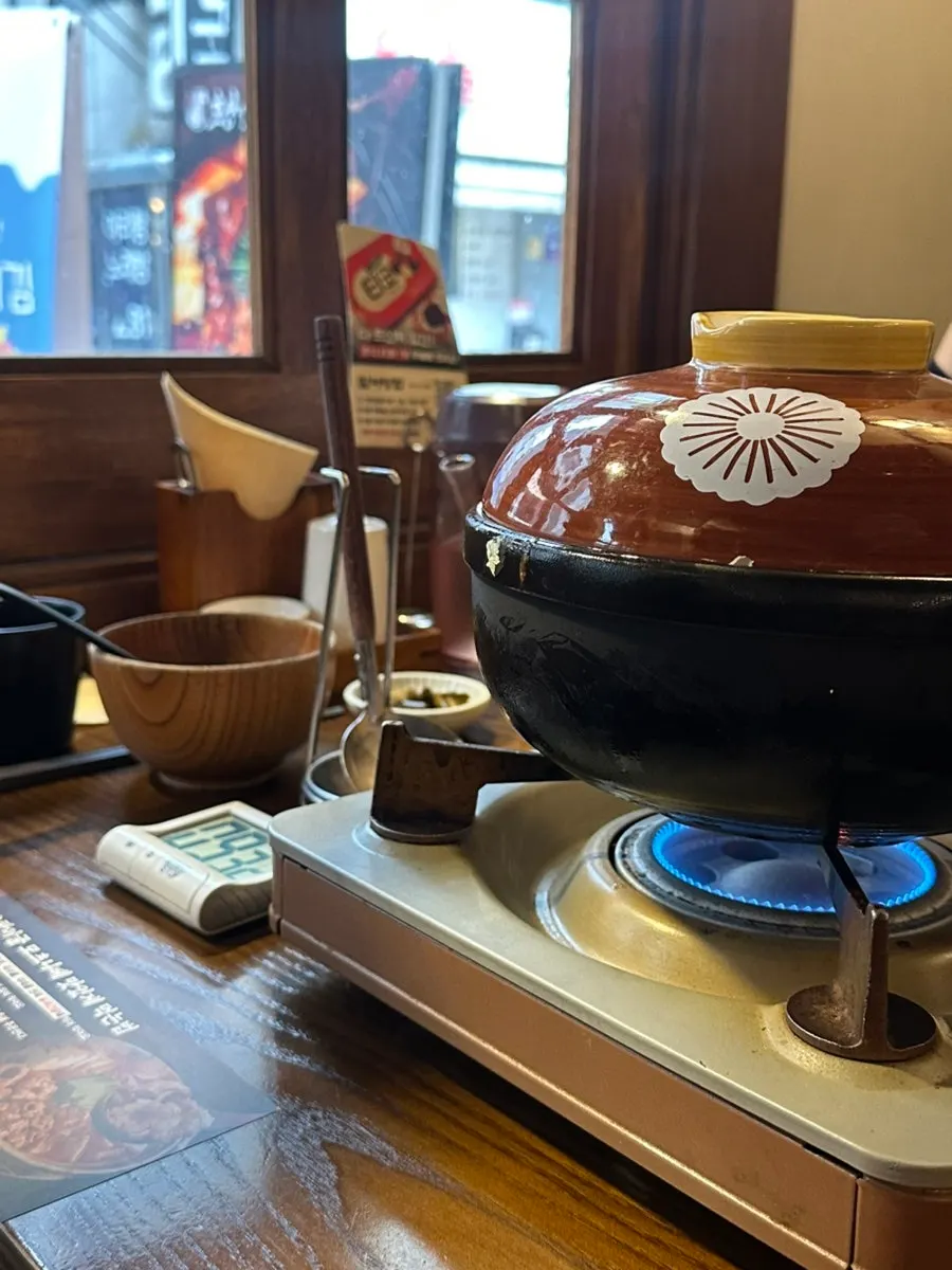 Gopchang hot pot boiling on the tabletop burner