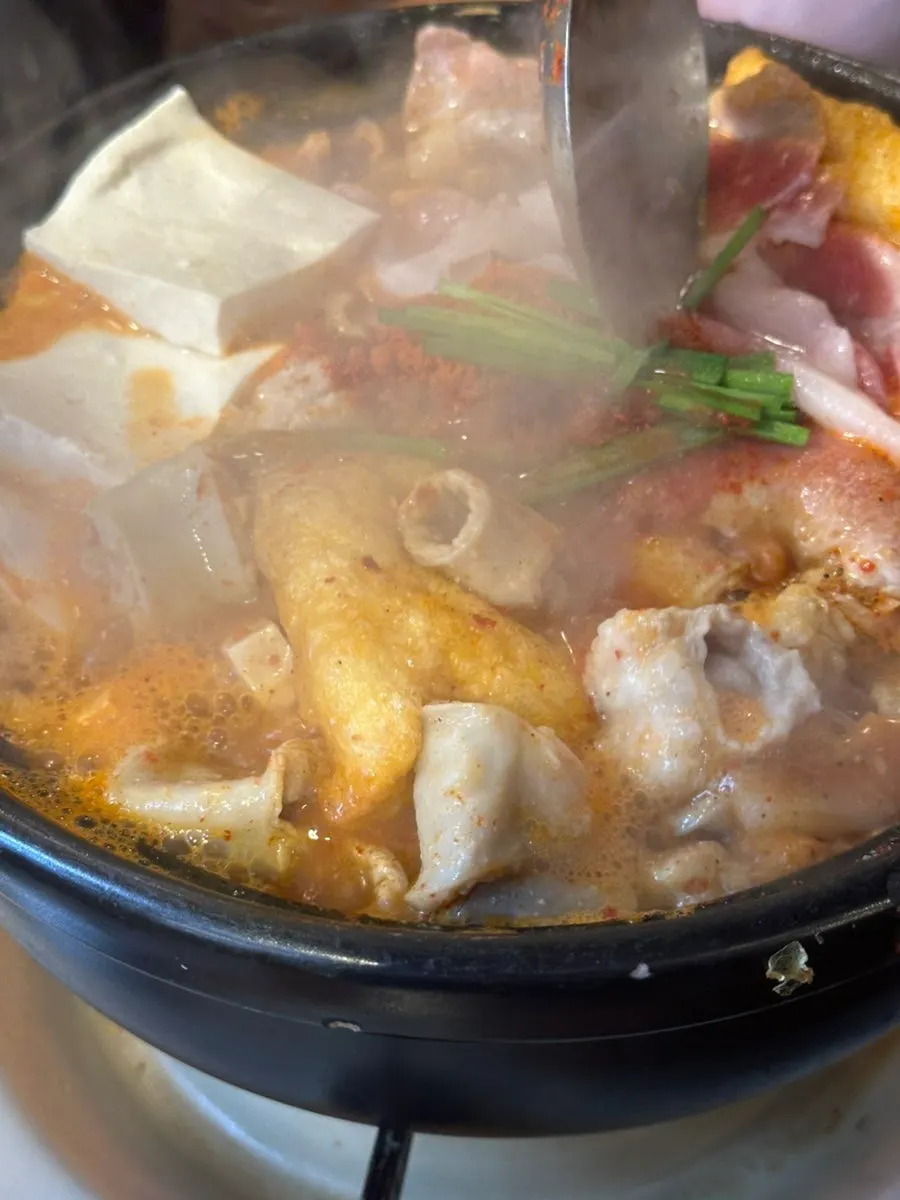 Bowl of spicy gopchang hot pot broth