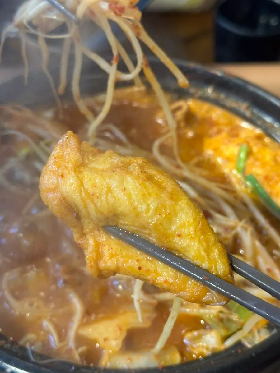 Meat and gopchang pieces from inside the hot pot