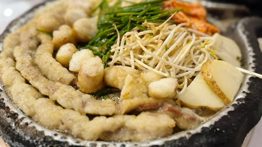 Hanwoo gopchang and daechang piled high on the hot plate