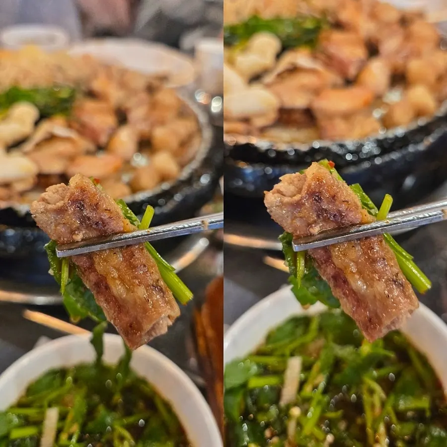 A piece of beef gopchang dipped in sauce