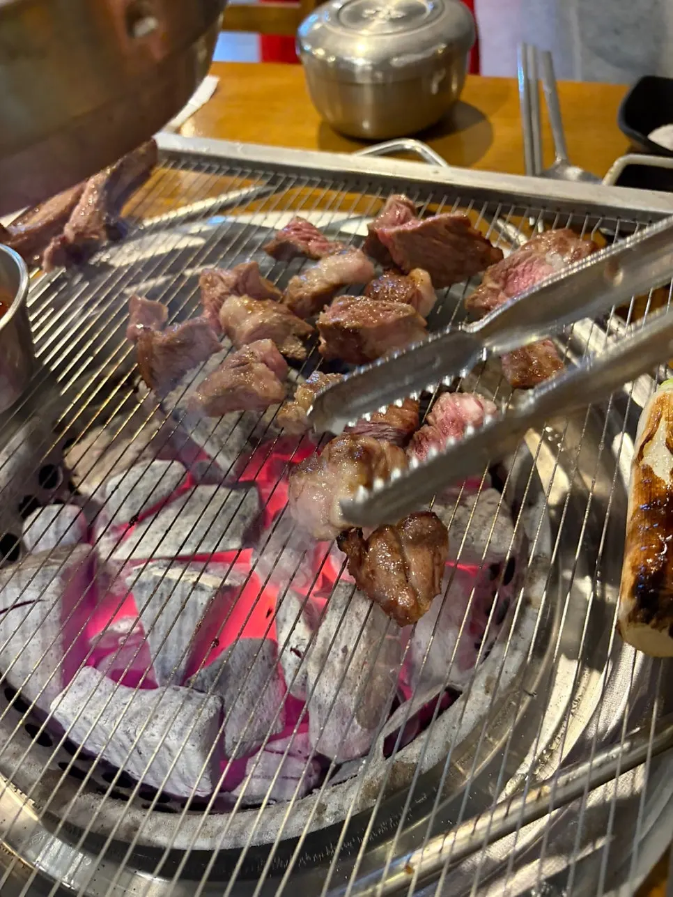Scored lamb ribs grilling