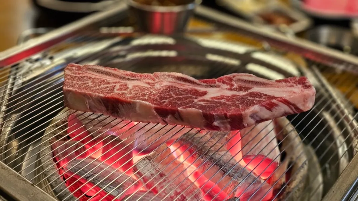 Snowflake galbi grilling on the charcoal grill