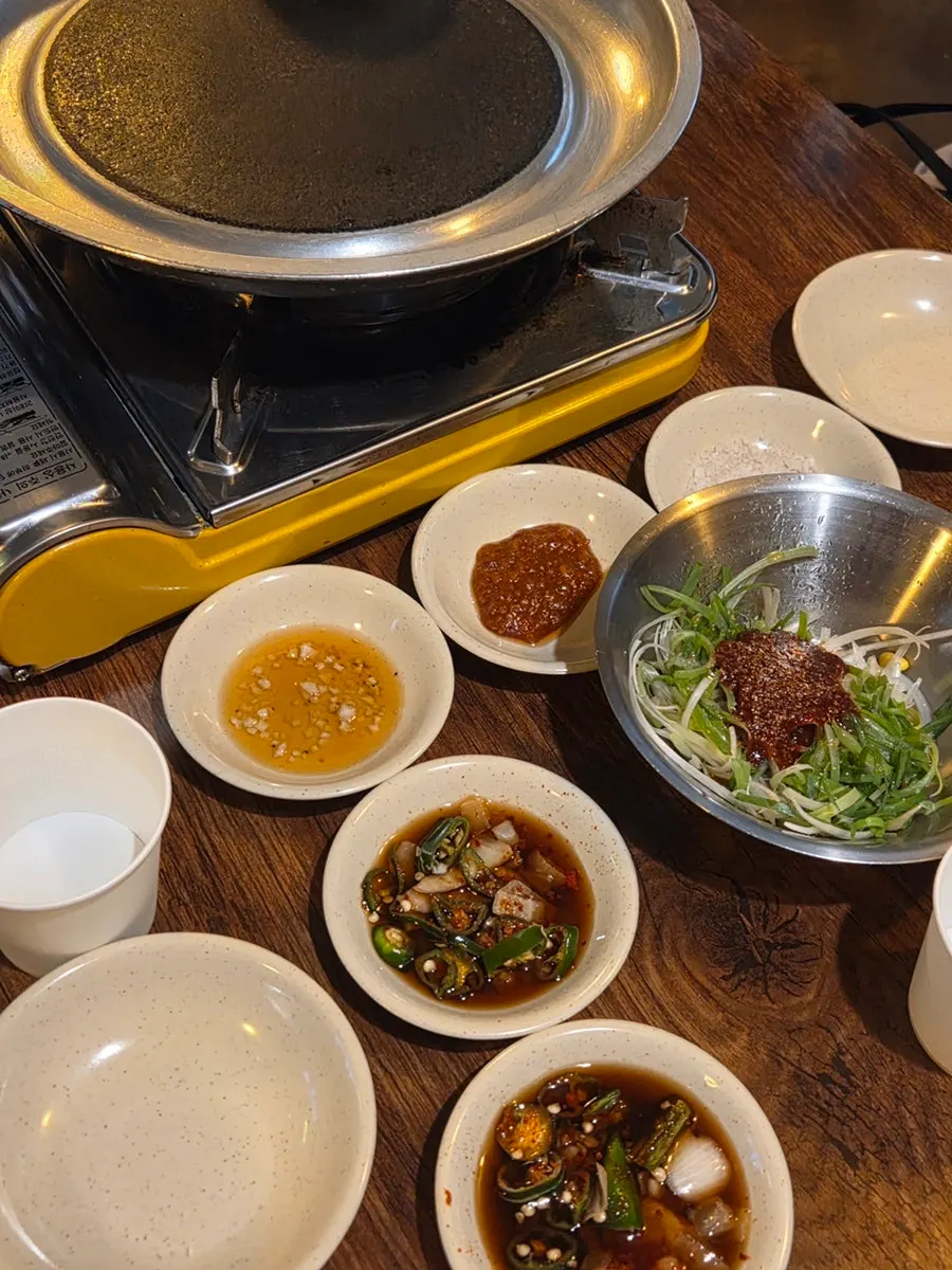 3-person trio spread with Korean beef brisket, specialty cuts, scallop, and aged kimchi