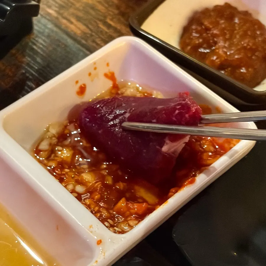 Mungtigi sauce mixed with garlic, chojang, and sesame oil