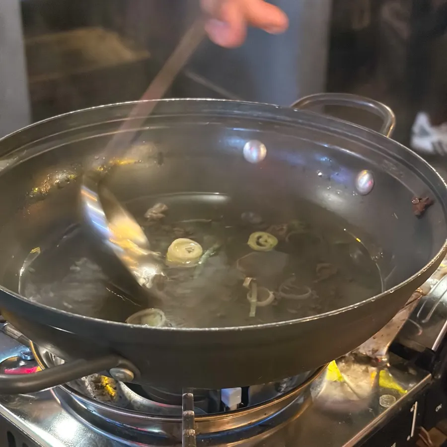 The bowl of complimentary beef soup after friends finished it off