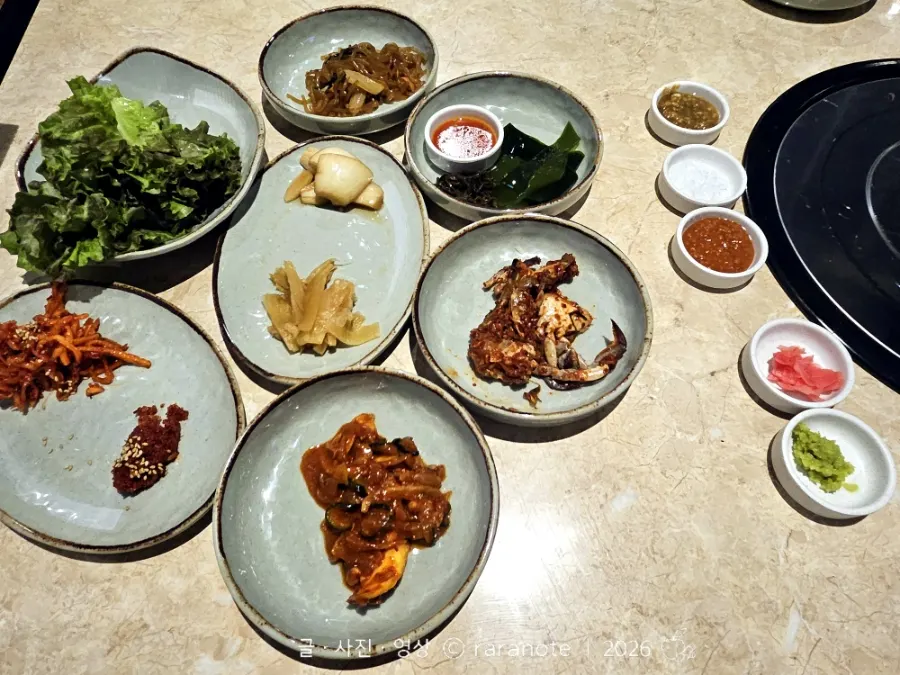 Various sauces served alongside the meat