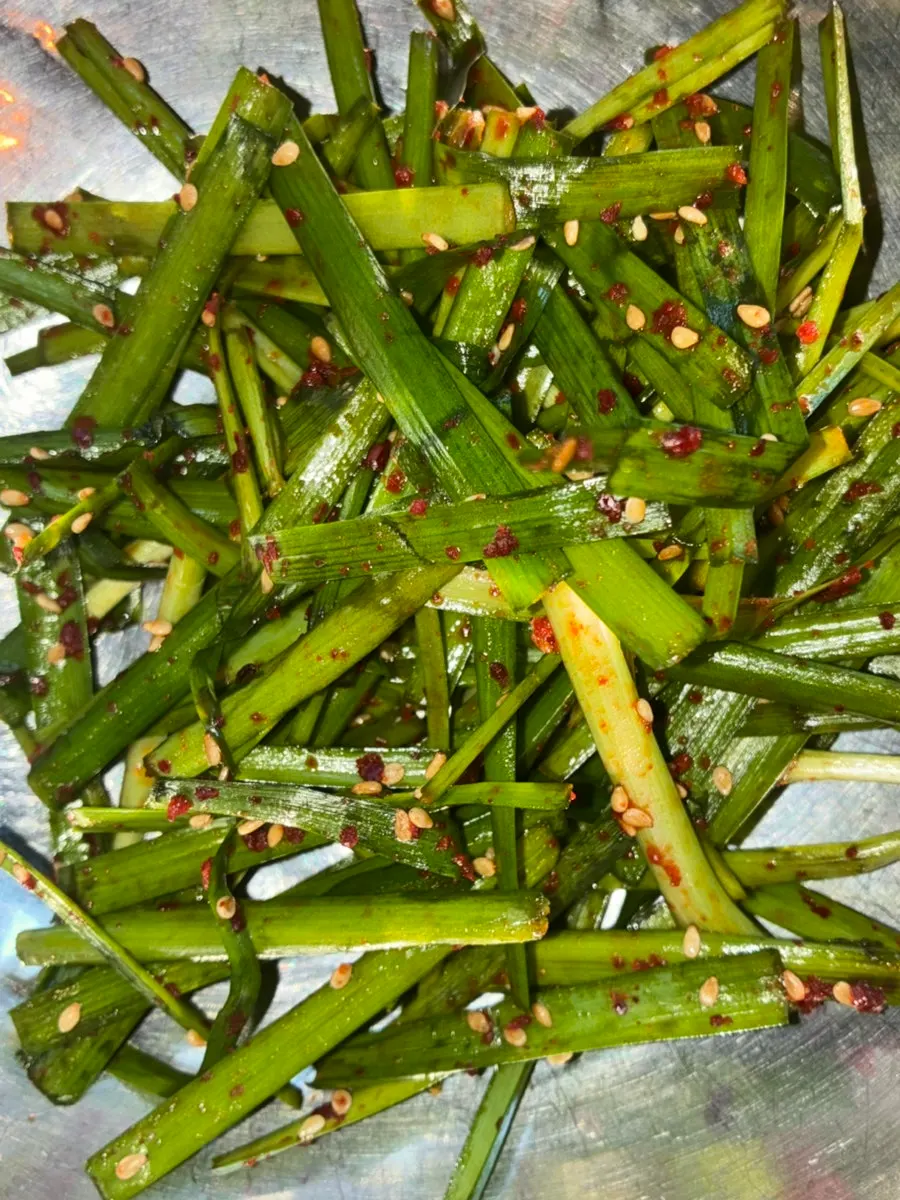 House-made mustard-leaf kimchi served as a complimentary side