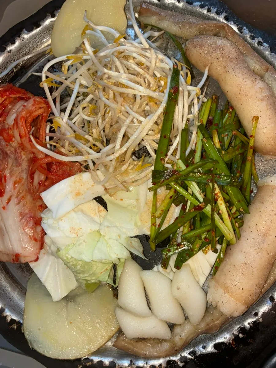Korean beef gopchang grilled by a staff member
