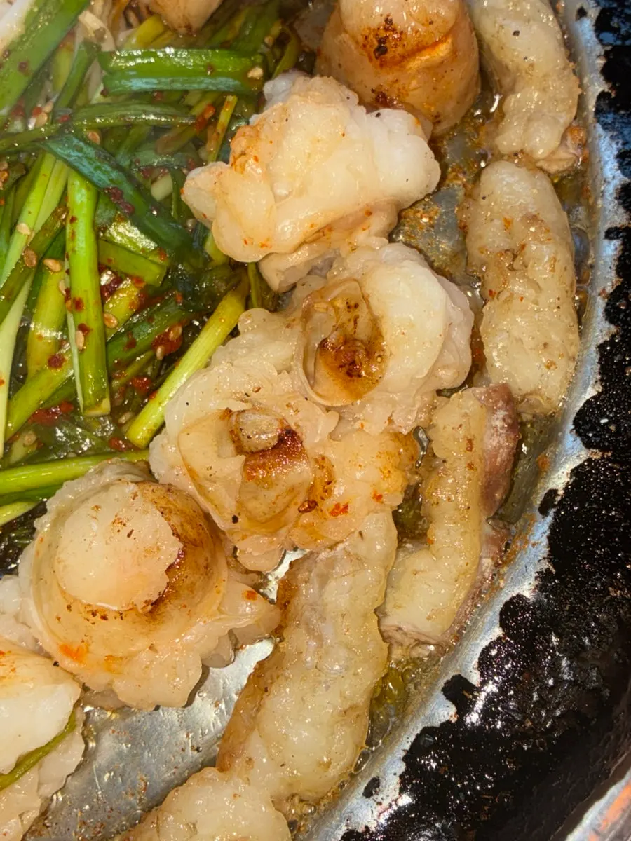 Korean beef gopchang with accompanying side dishes