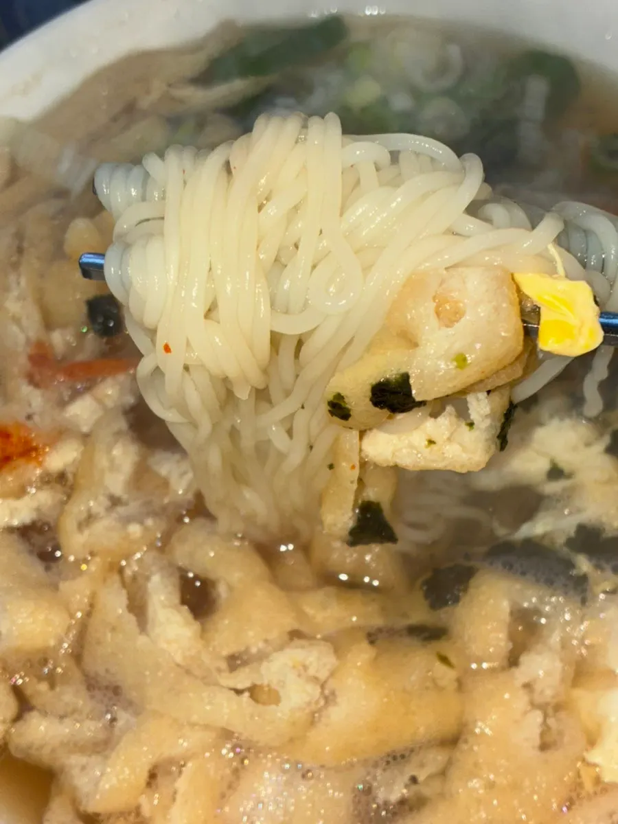 Anchovy noodles with fried tofu and egg strips