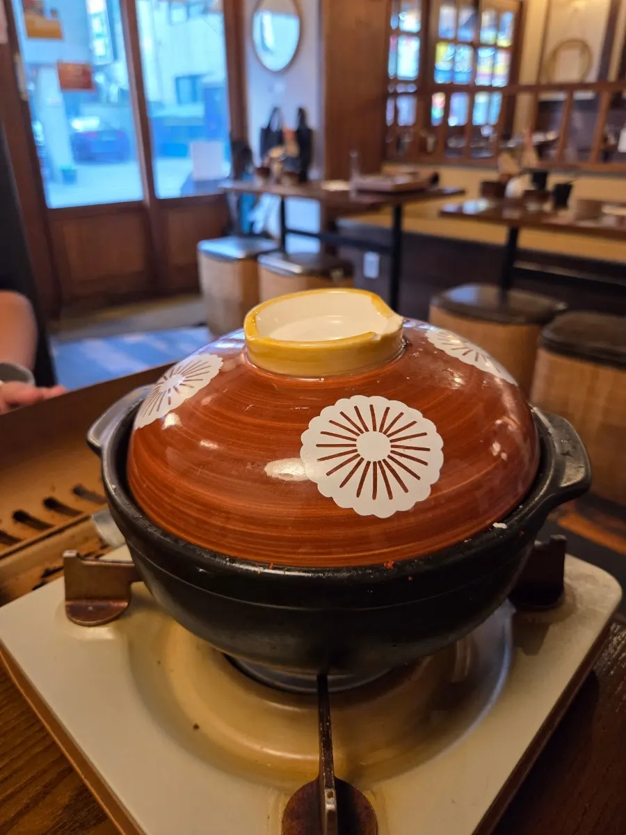Gopchang hot pot served with the lid on
