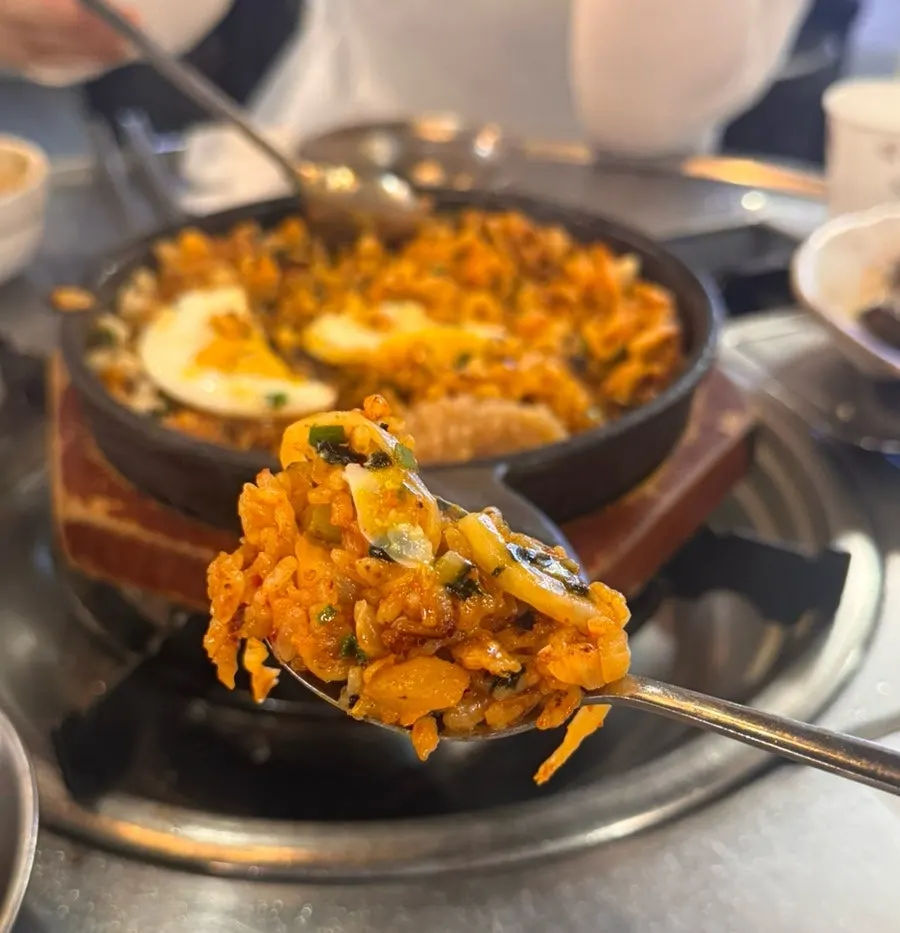 Kkakdugi fried rice topped with a fried egg