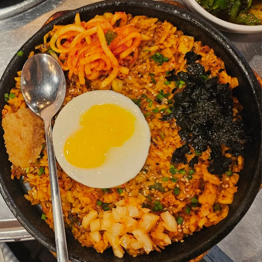 Tangy kimchi and rice pairing at Jinseong Hanwoo Gopchang Bangi Direct Branch