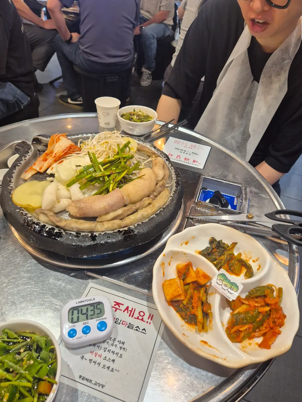 Gopchang being grilled by a staff member