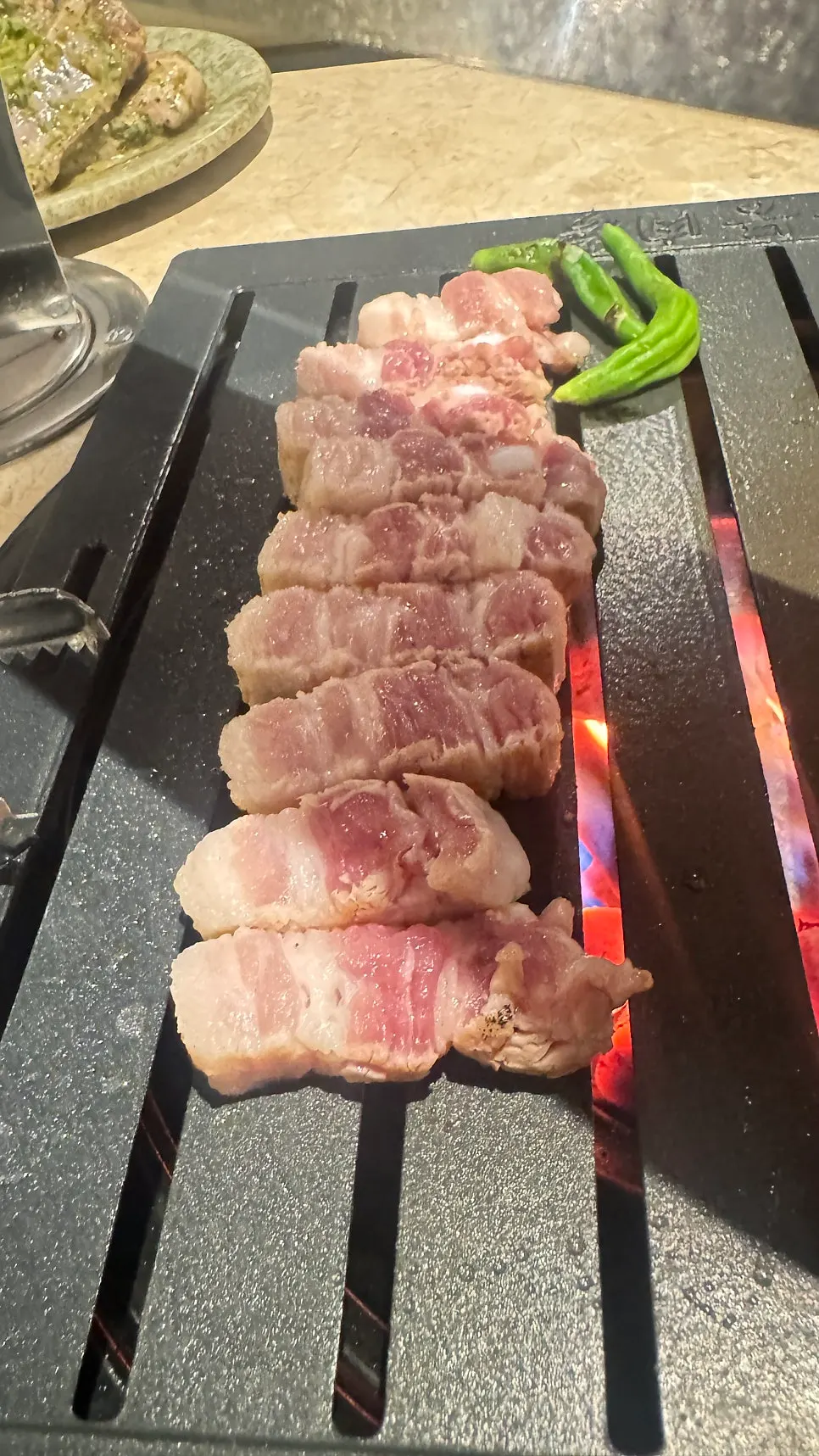 Galbi samgyeopsal cooking until golden