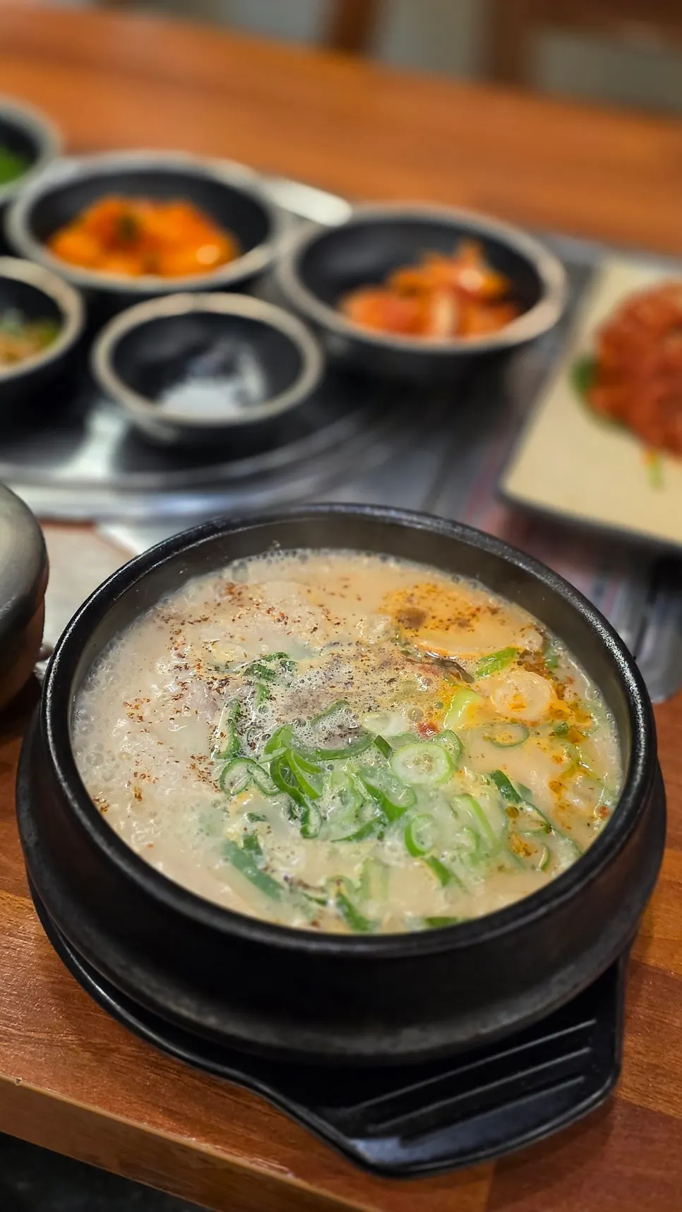 Fire-grilled pork and gukbap meal spread