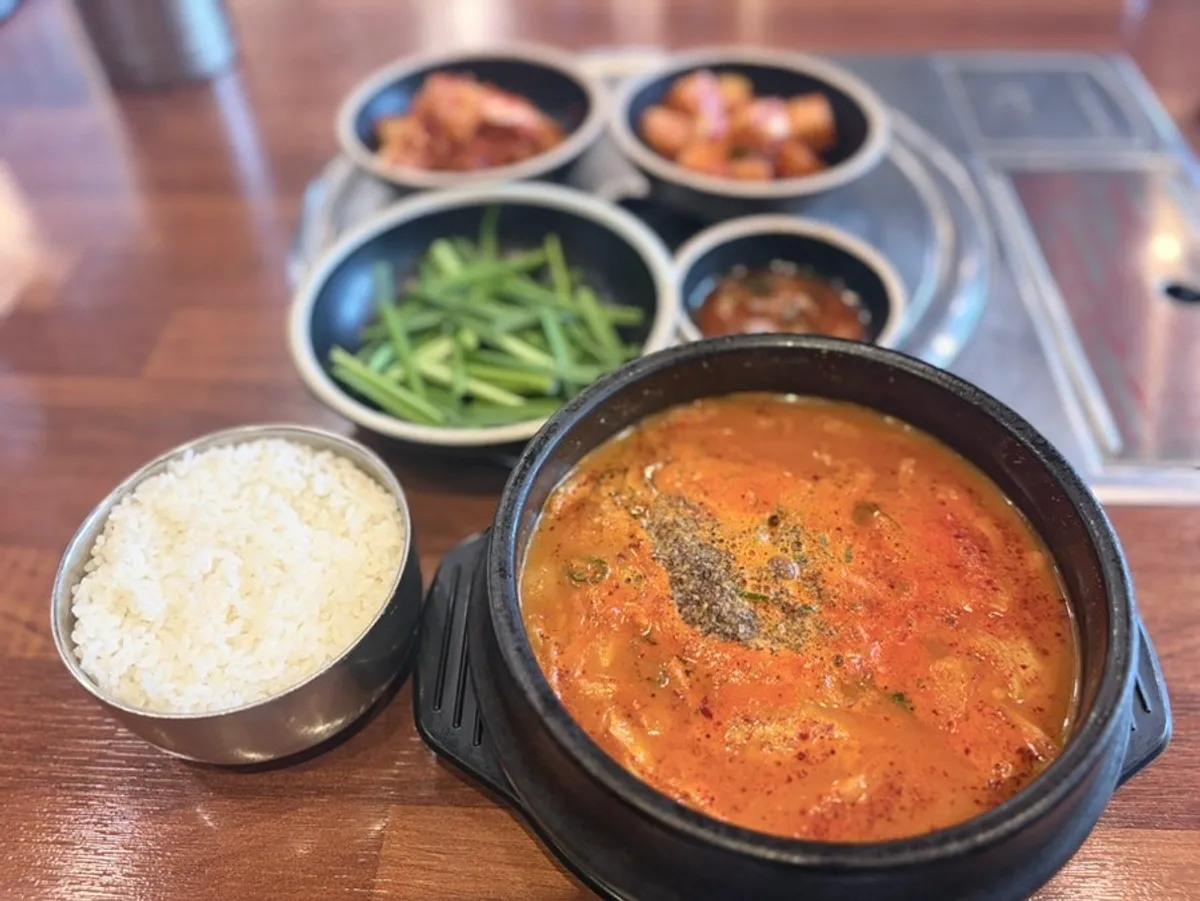 A bowl of spicy pork jowl gukbap