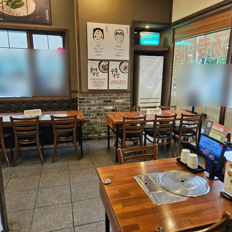 Restaurant interior with tables for two and four