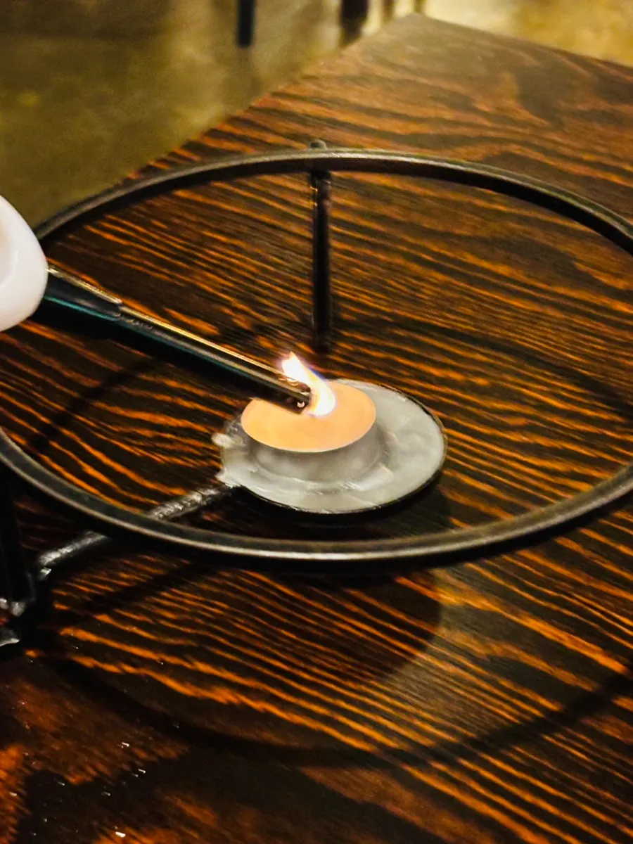 Margherita prepared with a candle