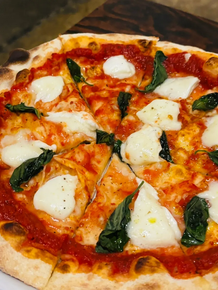 Tomato-sauce-based wood-fired pizza