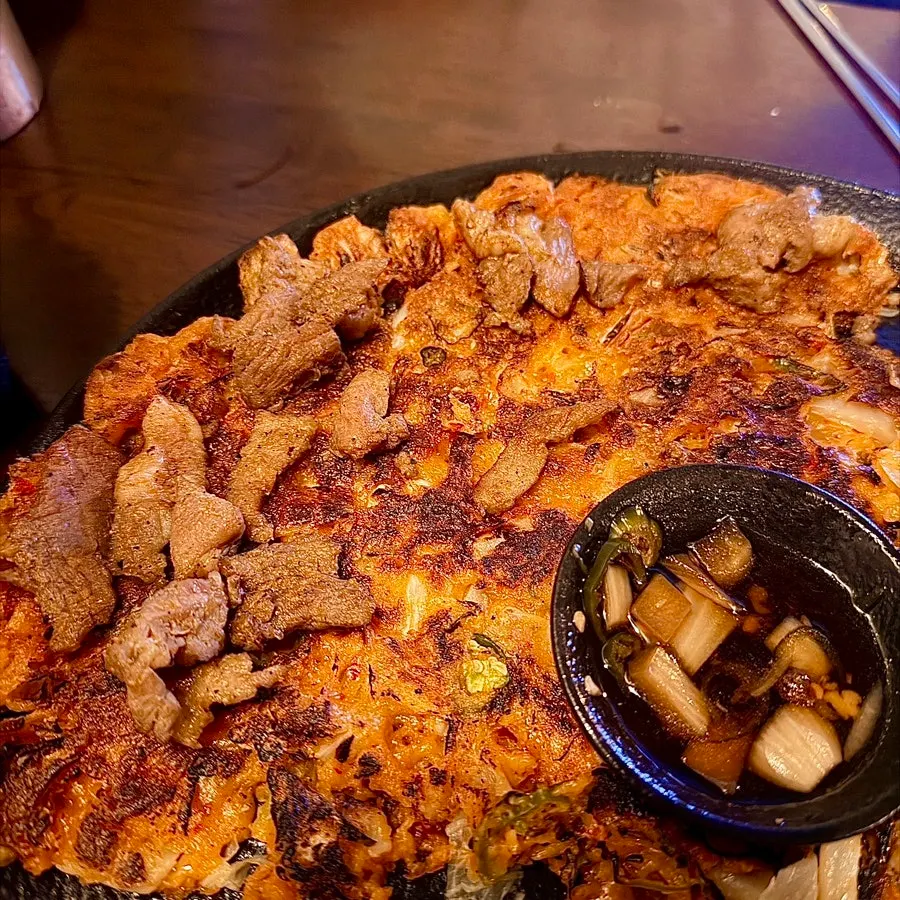 Kimchi jeon topped with bulgogi