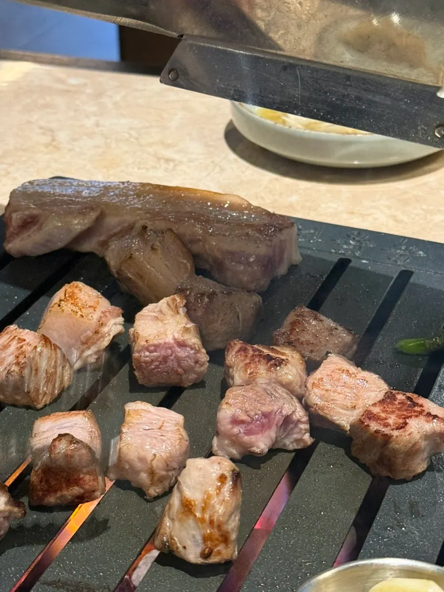 Juicy Korean pork neck grilled by staff