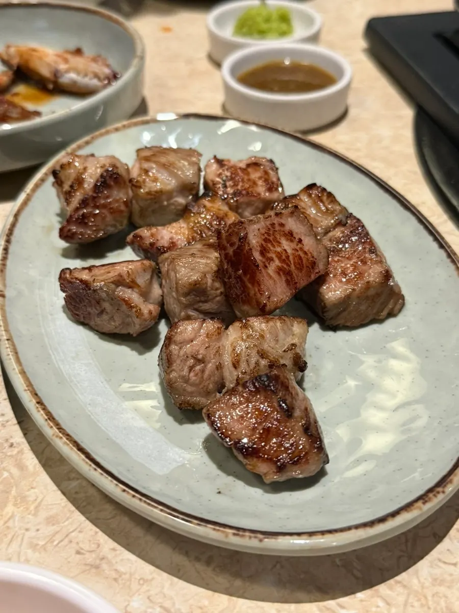 Juicy Korean pork neck grilled by staff