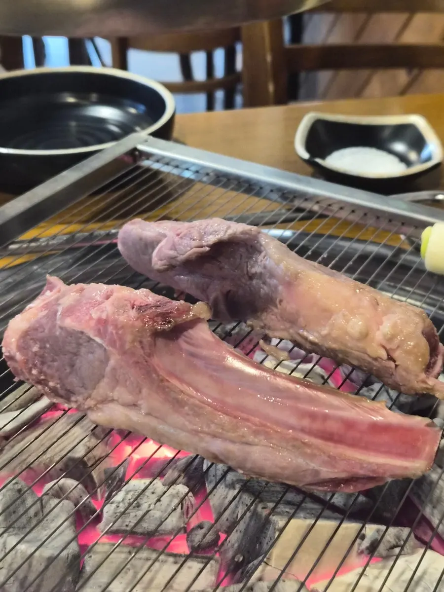 Lamb ribs and side-dish table setting
