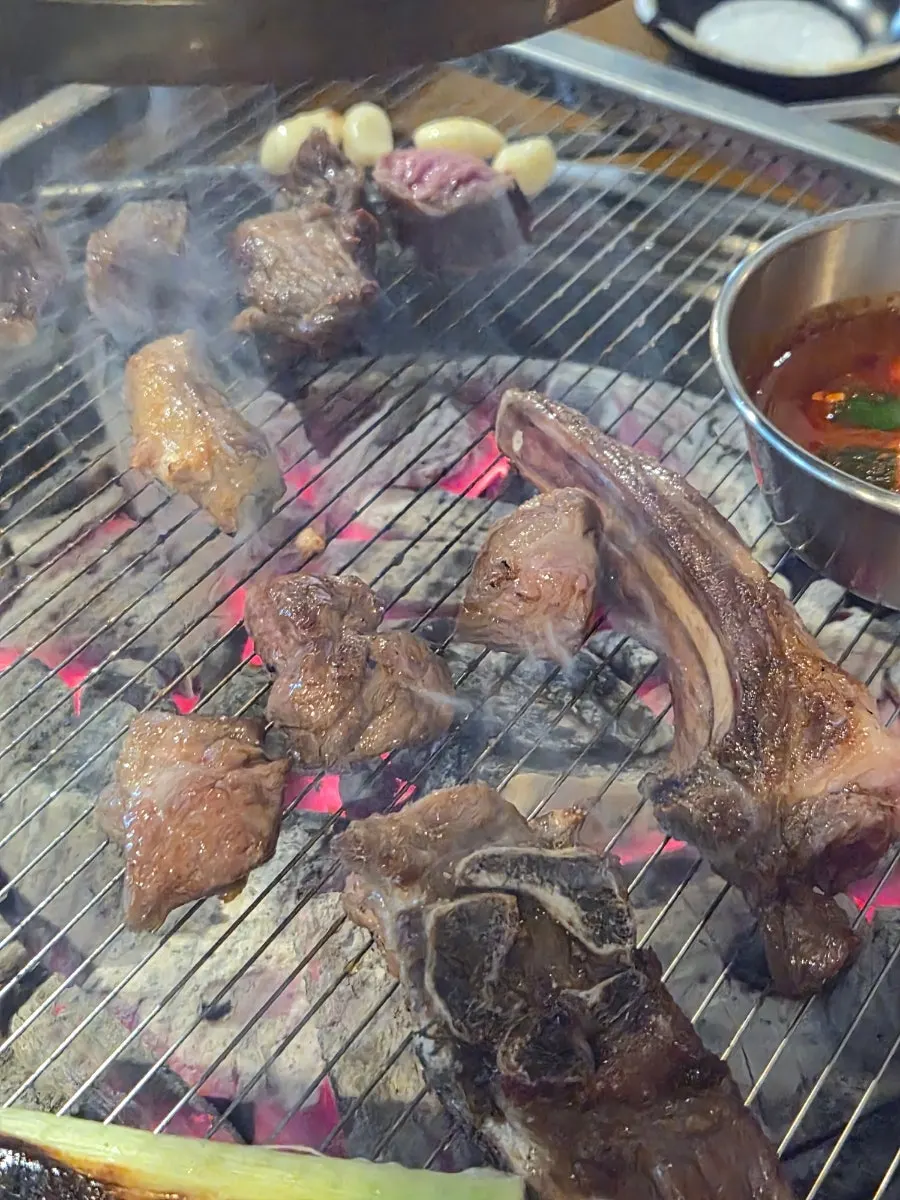 Lamb ribs grilling with green onions