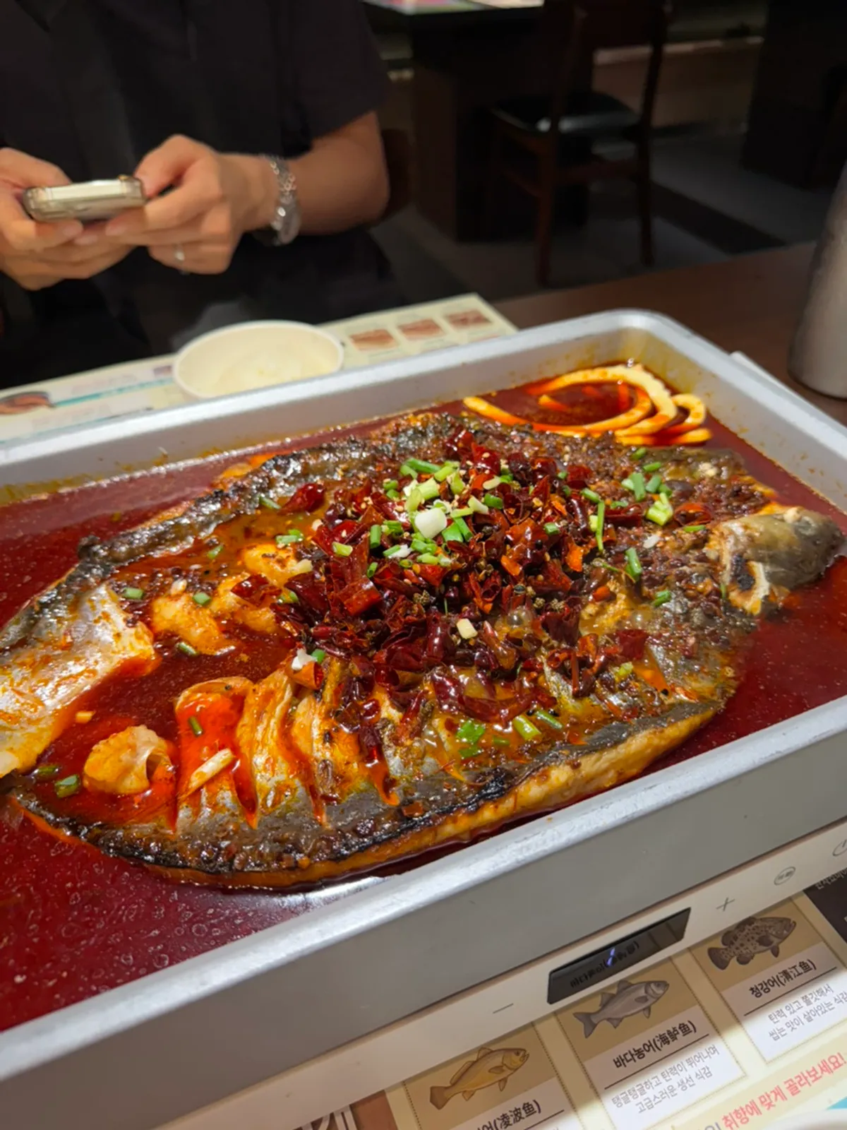 Mala kaoyu with ningbo fish starting to simmer