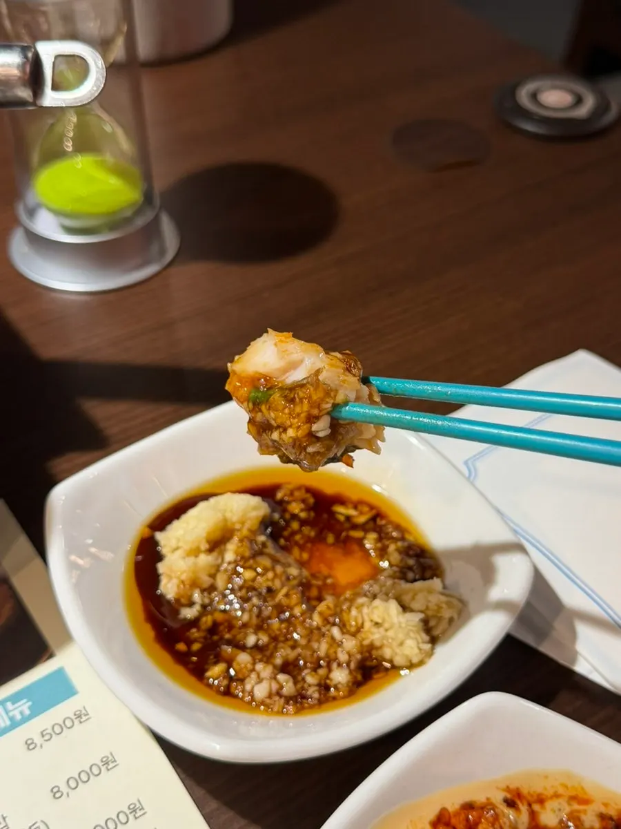 Fish meat dipped in sauce