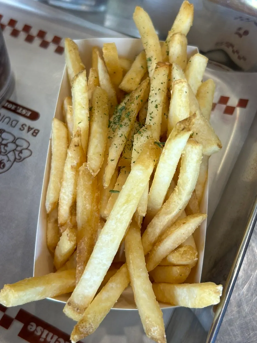 Potatoes dipped in house ketchup