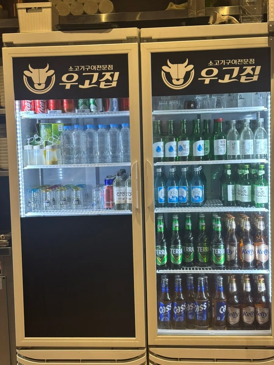 Drink menu listing beer, soju, and makgeolli