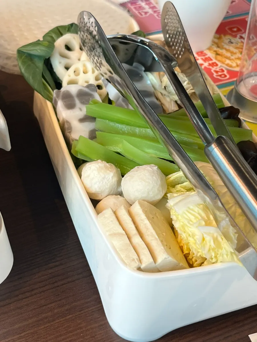 Table with self-bar sauces and the mixed vegetable-mushroom side