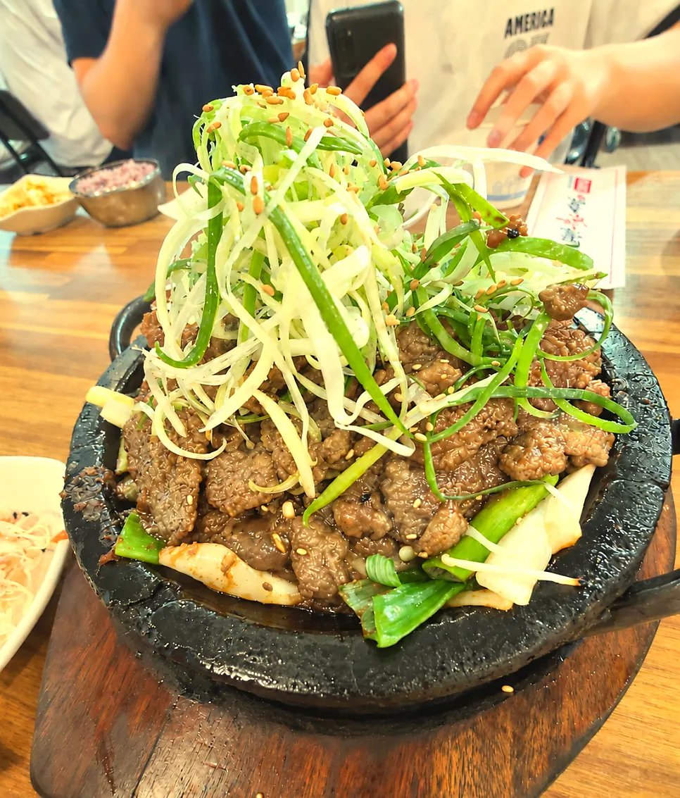Bujja short rib for two topped with shredded scallions