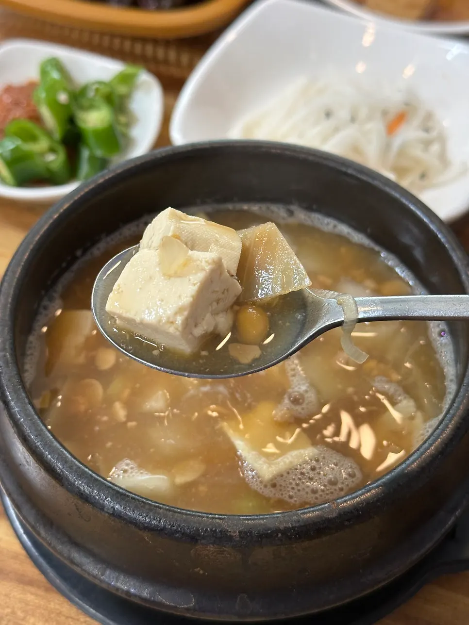 Pork stir-fry mixed in a stainless bowl