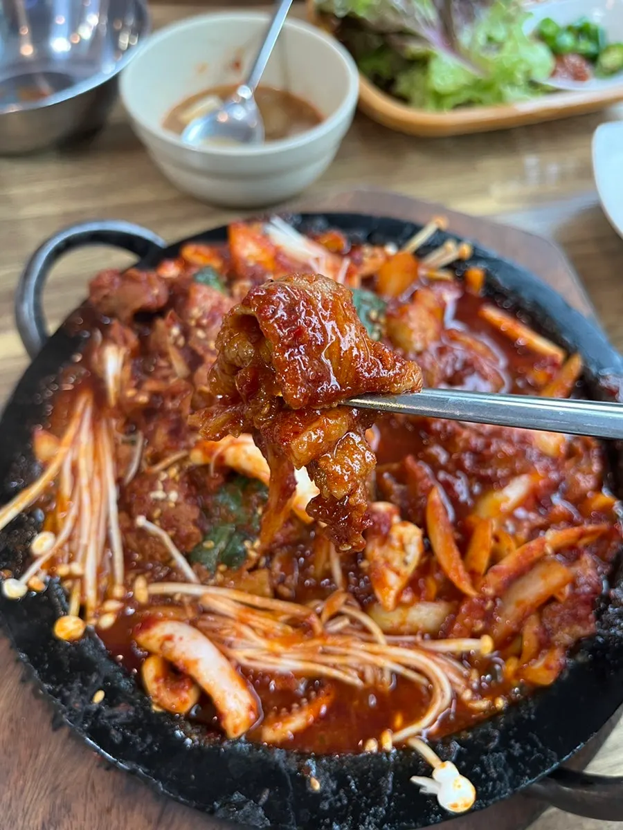 Close-up of sauce-soaked fire-grilled pork
