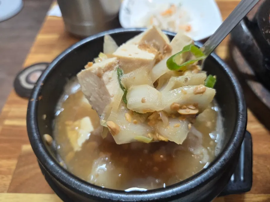 Cheonggukjang doenjang stew loaded with ingredients, served with rice