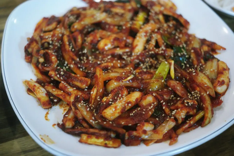 Close-up of squid stir-fry sprinkled with sesame seeds