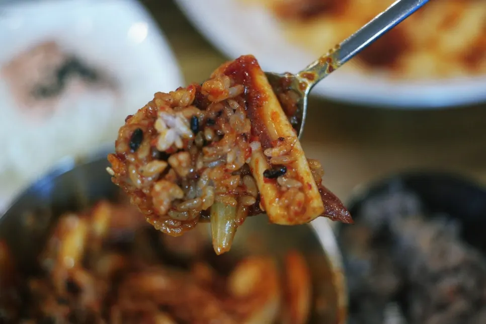Rice and squid stir-fry mixed together in a separate bowl