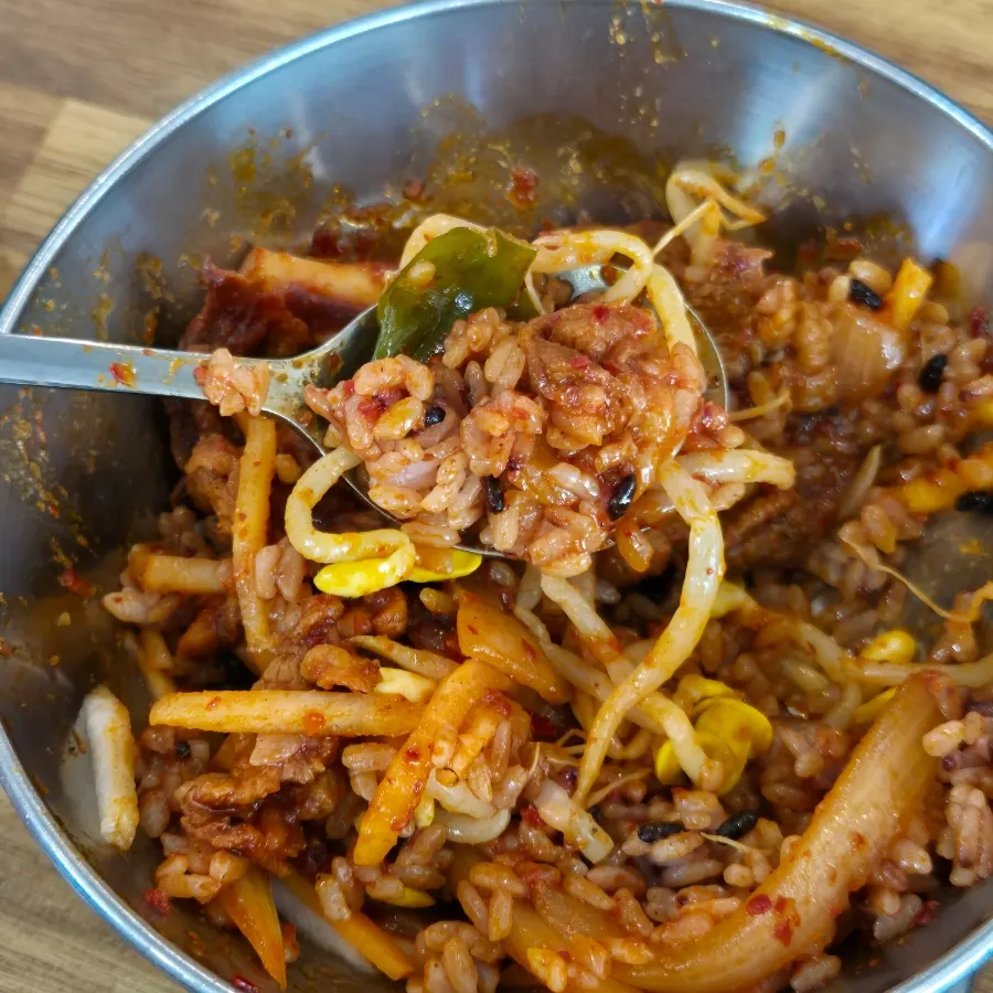 Squid and pork lifted up, coated in seasoning