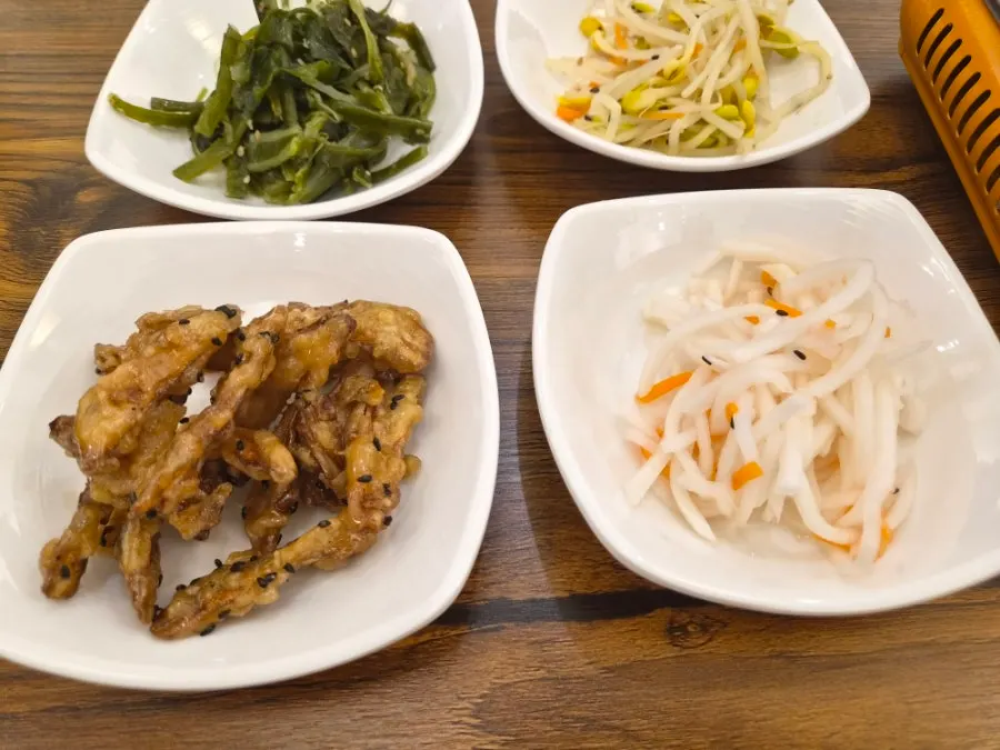 Plate of spicy radish salad and fried burdock side dish