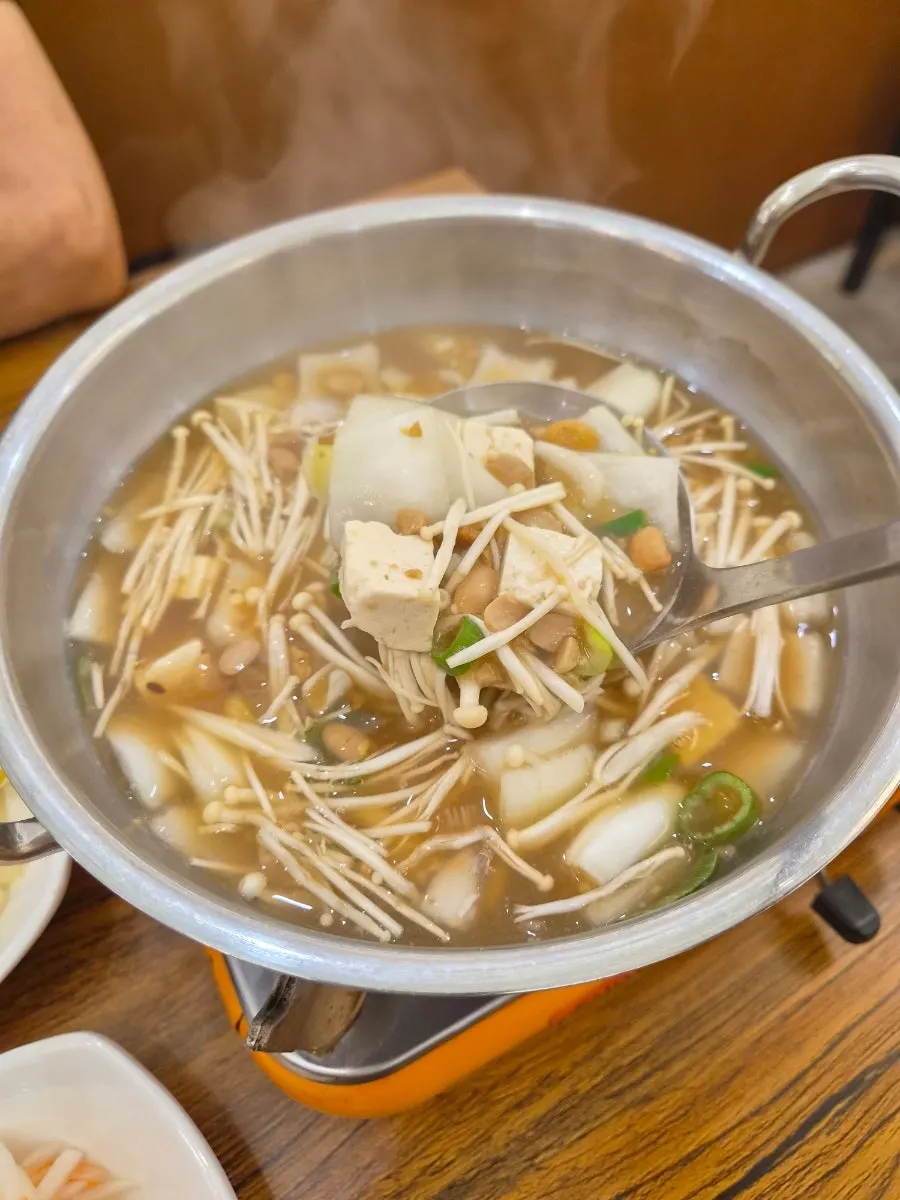 Cheonggukjang doenjang stew placed on the tabletop burner